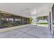 Large screened porch with a view of the backyard and exterior access at 4509 Wynkoop Cir, Port Charlotte, FL 33948