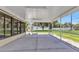 Screened-in porch offering serene views of the lush backyard at 4509 Wynkoop Cir, Port Charlotte, FL 33948