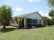 Charming home featuring a screened lanai and well-maintained landscaping at 500 Winwood Ct, Port Charlotte, FL 33954