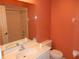 Cozy bathroom with white vanity, toilet, and shower-tub combo at 500 Winwood Ct, Port Charlotte, FL 33954