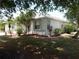 Well-maintained home showing professional landscaping and mature trees at 500 Winwood Ct, Port Charlotte, FL 33954