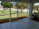 Relaxing screened patio perfect for enjoying the outdoors while overlooking a well maintained yard at 500 Winwood Ct, Port Charlotte, FL 33954