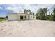 Home featuring large partially cleared backyard at 5018 Cillette Ave, North Port, FL 34288
