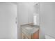Bright bathroom features a granite sink and a modern mirror at 5018 Cillette Ave, North Port, FL 34288