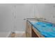 Bright bathroom features a double sink vanity, a tiled shower and modern fixtures at 5018 Cillette Ave, North Port, FL 34288