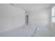 Bright bedroom featuring a window for natural light and an ensuite bathroom at 5018 Cillette Ave, North Port, FL 34288