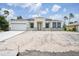 Charming single-story home with neutral paint, black trim, a two-car garage, and a modern architectural design at 5018 Cillette Ave, North Port, FL 34288
