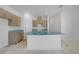 Bright kitchen with a large island, featuring modern cabinets and countertops, ready for finishing touches at 5018 Cillette Ave, North Port, FL 34288