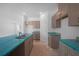Bright kitchen features an island with a sink, and sleek cabinets with modern hardware at 5018 Cillette Ave, North Port, FL 34288