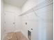 White walled laundry room with a utility sink hook up, and wire shelf above at 5018 Cillette Ave, North Port, FL 34288