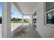 Covered back patio with a view of the partially cleared backyard at 5018 Cillette Ave, North Port, FL 34288
