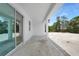 Covered patio with white columns and a view of the backyard at 5018 Cillette Ave, North Port, FL 34288