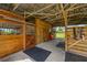 View of the barn showing the wood stalls and overhead beams at 5221 Blackjack Cir, Punta Gorda, FL 33982