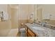 Bathroom featuring a granite countertop, a toilet, and a walk-in shower at 5221 Blackjack Cir, Punta Gorda, FL 33982