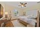 This bedroom has a bed, a desk, and a window at 5221 Blackjack Cir, Punta Gorda, FL 33982