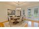 Dining room with elegant chandelier and ample natural light coming through the patio doors at 5221 Blackjack Cir, Punta Gorda, FL 33982