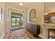 Welcoming foyer with stylish decor, a view to screened porch, and an open layout to the kitchen at 5221 Blackjack Cir, Punta Gorda, FL 33982