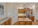 Kitchen with a stainless steel refrigerator and wooden cabinets at 5221 Blackjack Cir, Punta Gorda, FL 33982