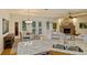 Kitchen seamlessly blending into the dining and living areas, creating an expansive open-concept space at 5221 Blackjack Cir, Punta Gorda, FL 33982