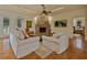 Inviting living room with a stone fireplace, plush seating, and an open layout at 5221 Blackjack Cir, Punta Gorda, FL 33982