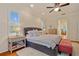Bright main bedroom featuring a tufted headboard, lots of natural light and bedside table at 5221 Blackjack Cir, Punta Gorda, FL 33982
