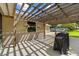 Outdoor space with pergola, featuring patio and a grill, with views of the backyard at 5221 Blackjack Cir, Punta Gorda, FL 33982