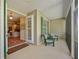 Cozy screened porch featuring comfortable seating and a view into the living area at 5221 Blackjack Cir, Punta Gorda, FL 33982