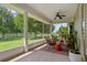 Inviting screened porch with comfortable seating and serene views of the expansive, lush green yard at 5221 Blackjack Cir, Punta Gorda, FL 33982