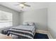 Bright bedroom featuring ceiling fan and large window allowing for ample natural light at 5273 Crestline Ter, Port Charlotte, FL 33981