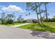 Charming single Gathering home with a well-manicured lawn and long private driveway in a lush landscape at 5273 Crestline Ter, Port Charlotte, FL 33981
