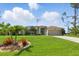 Well-maintained lawn and landscaping in front of this charming single-story home at 5273 Crestline Ter, Port Charlotte, FL 33981