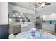 A kitchen featuring vaulted ceilings, light blue cabinets, and a farmhouse sink at 5273 Crestline Ter, Port Charlotte, FL 33981