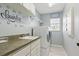 Well-organized laundry room featuring modern washer and dryer, utility sink and storage cabinets at 5273 Crestline Ter, Port Charlotte, FL 33981