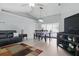 Open-concept living area with pool view, modern lighting, and light gray walls at 5273 Crestline Ter, Port Charlotte, FL 33981
