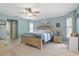Main bedroom featuring wood floors and a large bed at 5273 Crestline Ter, Port Charlotte, FL 33981
