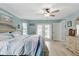 Main bedroom featuring wood floors and french doors that access the backyard at 5273 Crestline Ter, Port Charlotte, FL 33981