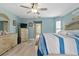 Main bedroom featuring wood floors, beach themed decor, and an ensuite bathroom at 5273 Crestline Ter, Port Charlotte, FL 33981