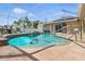 Screened-in pool with patio, landscaping, and room for lounging at 5273 Crestline Ter, Port Charlotte, FL 33981