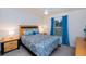 Charming bedroom with bright walls, decorative ceiling fan, and natural light provides a comfortable and inviting space at 591 San Ambrosio St, Punta Gorda, FL 33983