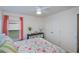 Comfortable bedroom with soft carpet, stylish bedding, and ample closet space offers a relaxing and organized retreat at 591 San Ambrosio St, Punta Gorda, FL 33983