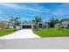 Charming home with lush landscaping, a spacious driveway, and an attached garage at 591 San Ambrosio St, Punta Gorda, FL 33983
