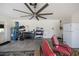 Spacious garage with a ceiling fan, shelving, and plenty of room for storage and activities at 591 San Ambrosio St, Punta Gorda, FL 33983