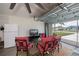 Relaxing garage featuring comfortable chairs, television, and access to outside at 591 San Ambrosio St, Punta Gorda, FL 33983