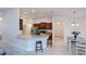 Open kitchen with stainless steel appliances, granite countertops, and breakfast bar at 591 San Ambrosio St, Punta Gorda, FL 33983