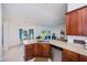 Bright kitchen with stainless steel appliances, granite countertops, and breakfast bar at 591 San Ambrosio St, Punta Gorda, FL 33983
