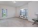 Bright living room with arched window, neutral paint, and carpet at 591 San Ambrosio St, Punta Gorda, FL 33983