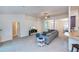 Comfortable living room featuring neutral paint, carpet, and an open layout at 591 San Ambrosio St, Punta Gorda, FL 33983