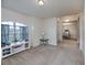 Bright living room with arched window, neutral paint, and carpet at 591 San Ambrosio St, Punta Gorda, FL 33983