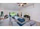 Bright living room with neutral paint, plush carpet, vaulted ceiling, and access to lanai at 591 San Ambrosio St, Punta Gorda, FL 33983