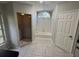 Full bathroom featuring tiled shower, separate bathtub, window, and tile flooring at 726 Chevy Chase St, Port Charlotte, FL 33948